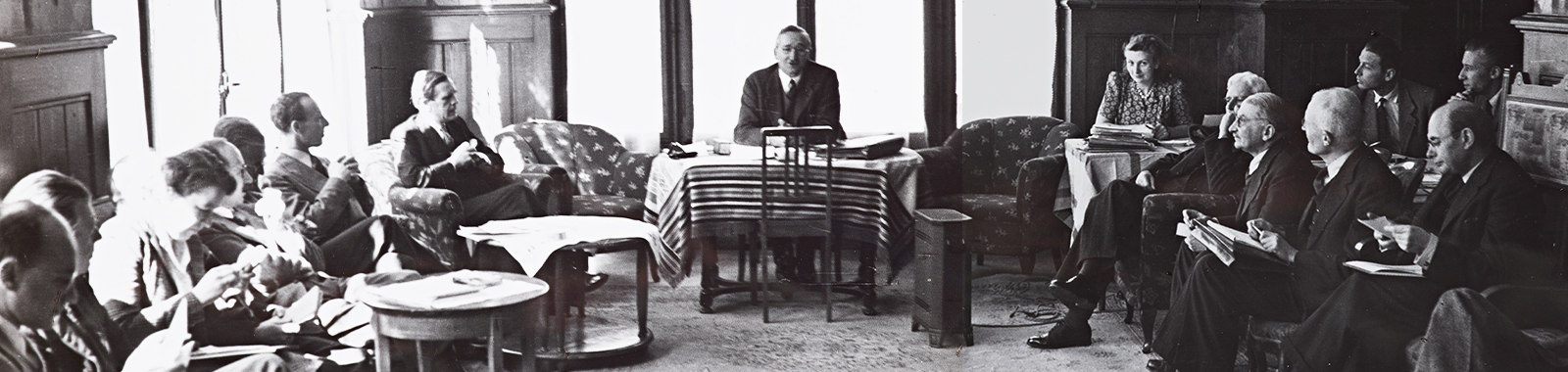 detail of a photograph of a photo album page showing the first meeting of the Mont Pelerin Society, with Hayek seated at center
