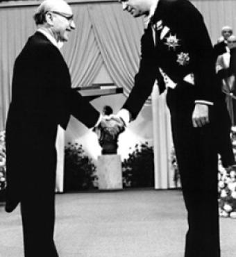 Milton Friedman receives the 1976 Bank of Sweden Prize in Economic Sciences in Memory of Alfred Nobel from King Carl XVI Gustaf of Sweden.