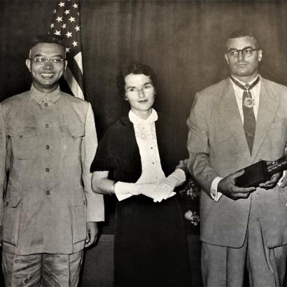 Black and white photograph of Wei Daming (left) and E. S. Belknap (second from right)