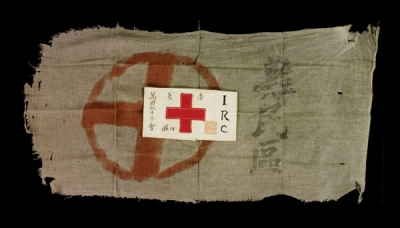 A tattered flag and armband of the International Red Cross survive from the 1937 Nanjing massacre.