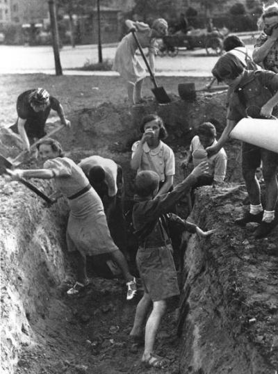 Polish civilians, including children, dig an antitank trench in 1939 as the Battle of Warsaw commences.