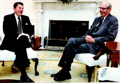 Ronald Reagan and George Stigler share a story in the White House, October 27, 1982.