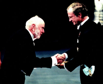 Douglass C. North receives the 1993 Bank of Sweden Prize in Economic Sciences in Memory of Alfred Nobel from King Carl XVI Gustaf of Sweden.