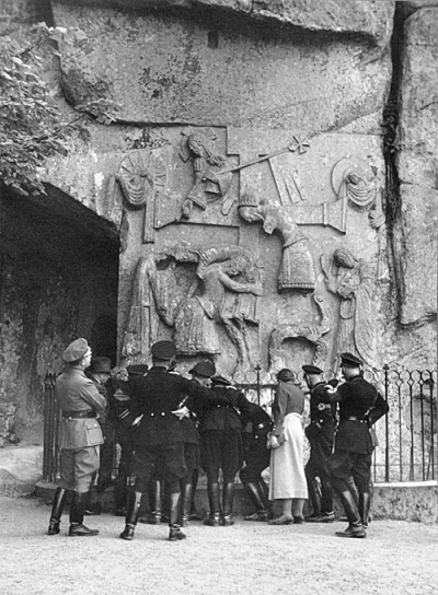 Himmler and party examine a bas-relief at the Externsteine, a rock formation in northwest Germany with ritualistic associations.