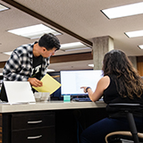 Researcher asking question in the reading room