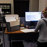 Archivist working on cataloging a collection 