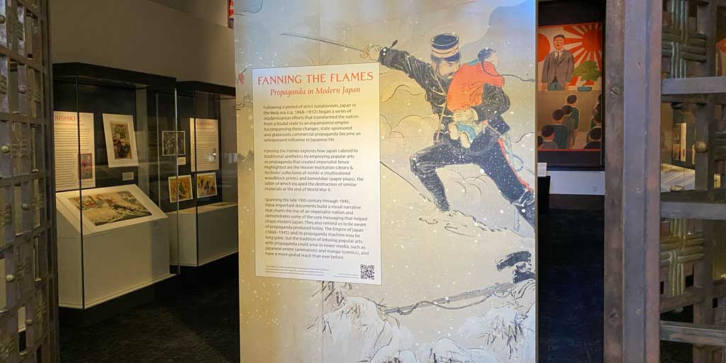 Photograph of the entrance to the Fanning the Flames exhibition in Hoover Tower, 2022