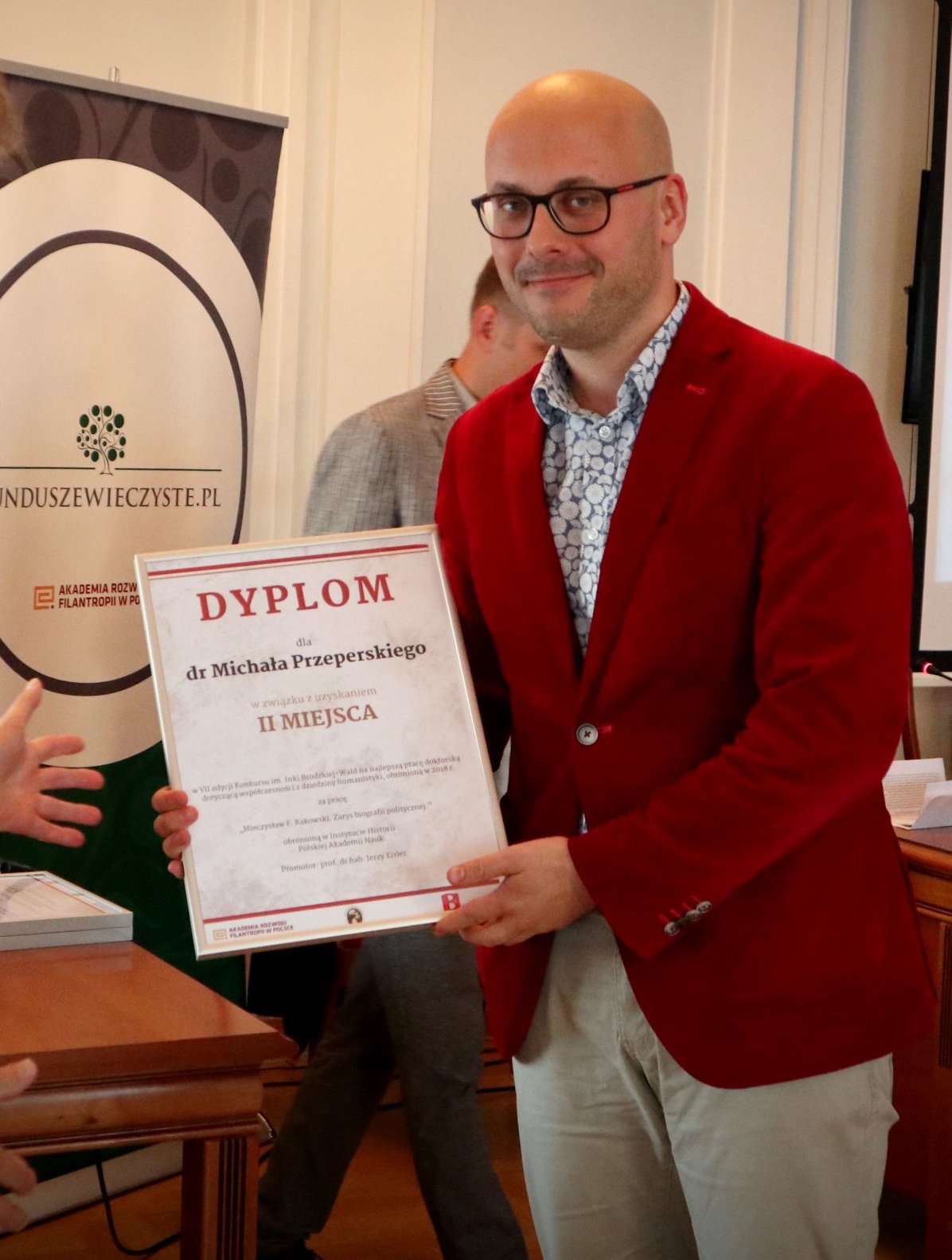 Photograph of Dr. Michał Przeperski receiving his dyploma