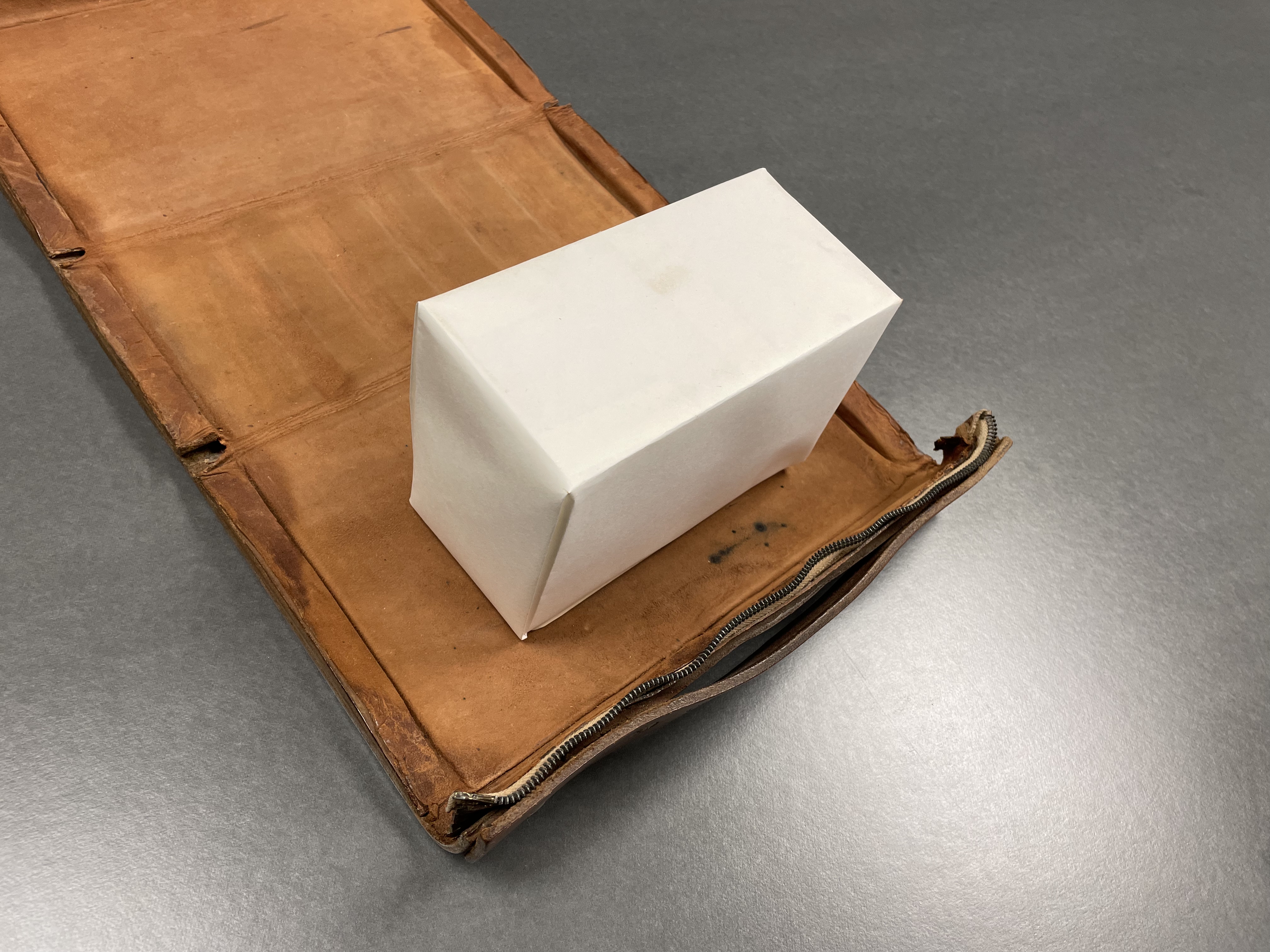 Exhibition compensation blocks fill in the space that Bibles would take up in their outer cases while the books are on display