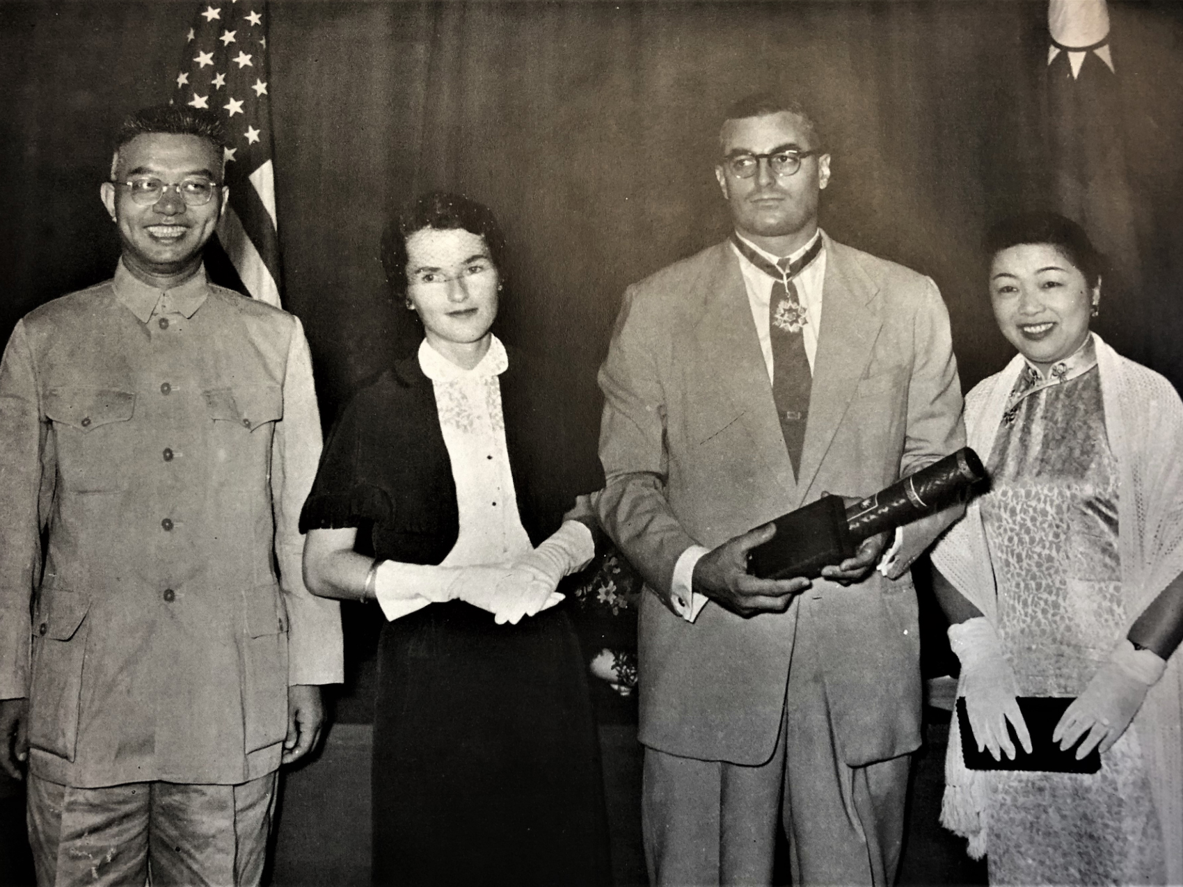 Black and white photograph of Wei Daming (left) and E. S. Belknap (second from right)