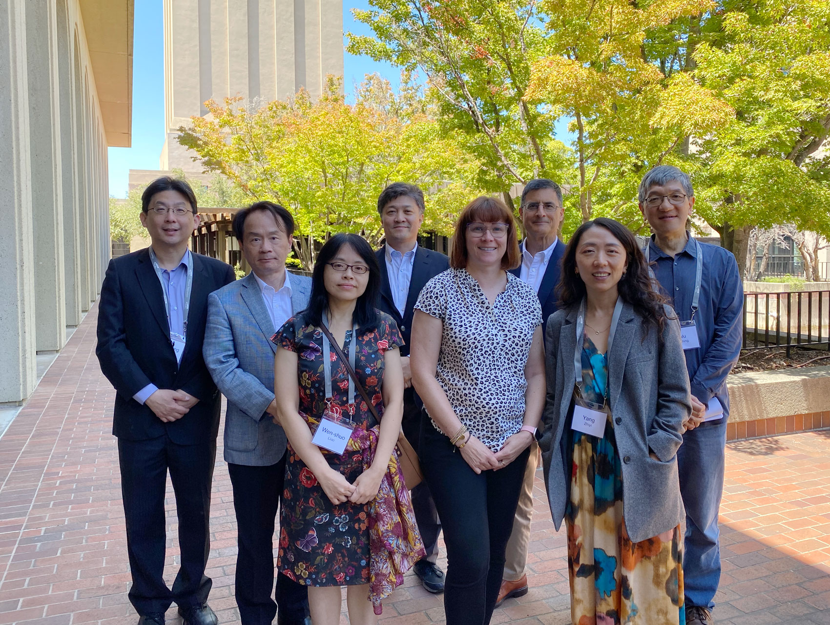 Modern China and Taiwan Workshop 2023 speakers stand in front of Hoover Tower and HHMB