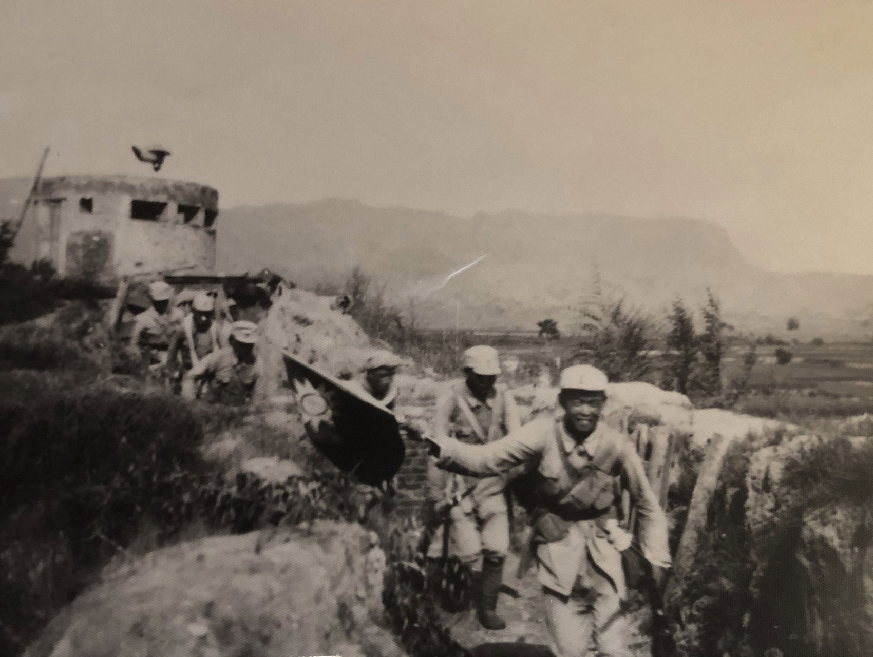 Black and white image of Communist Chinese guerrillas fight with the Japanese. Sha Fei papers.