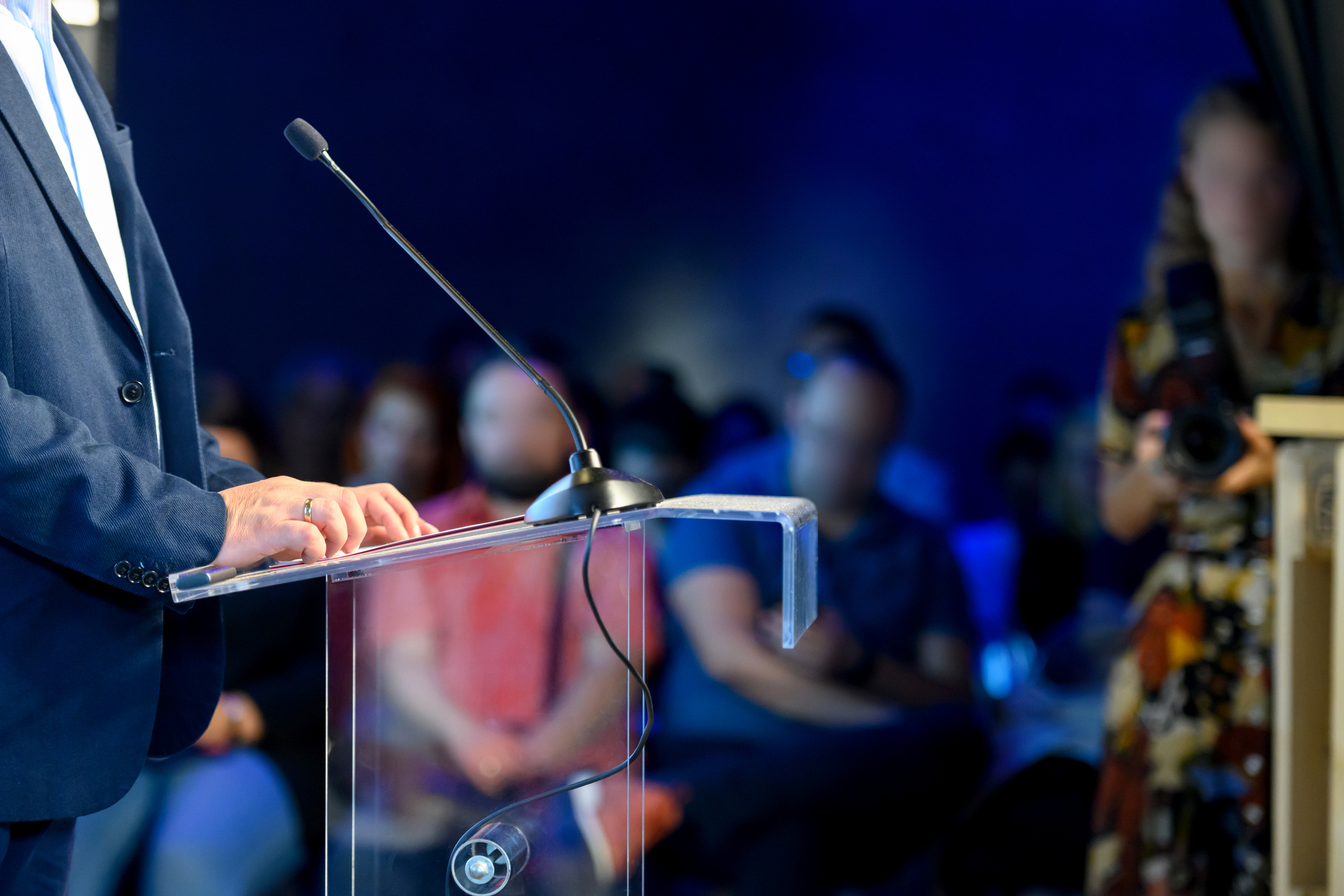 Speaker at podium making a speech