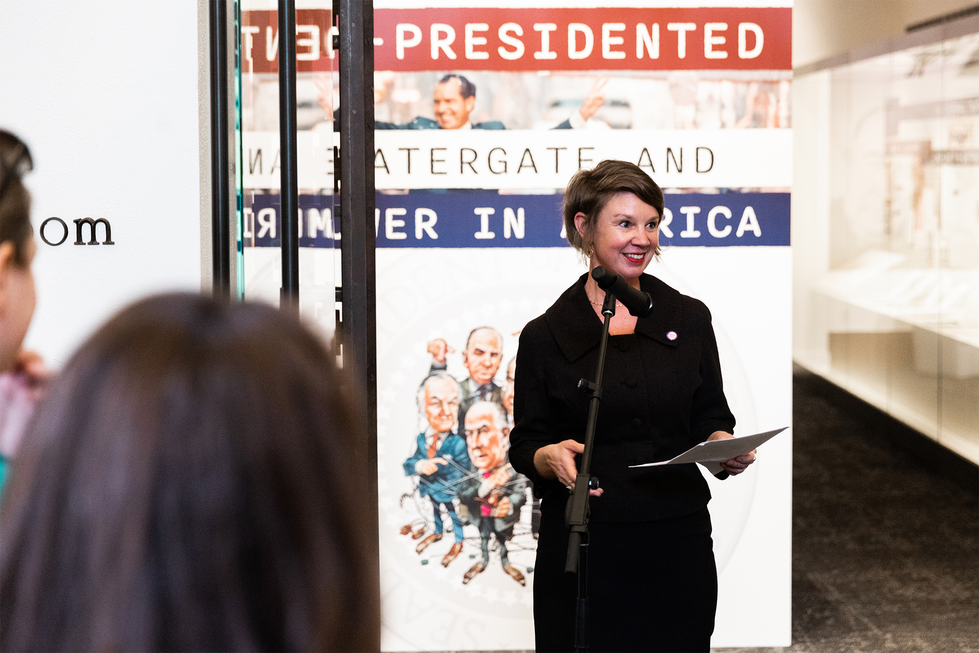 Curator Jean McElwee Cannon speaking at Unpresidented exhibition opening, February 2024