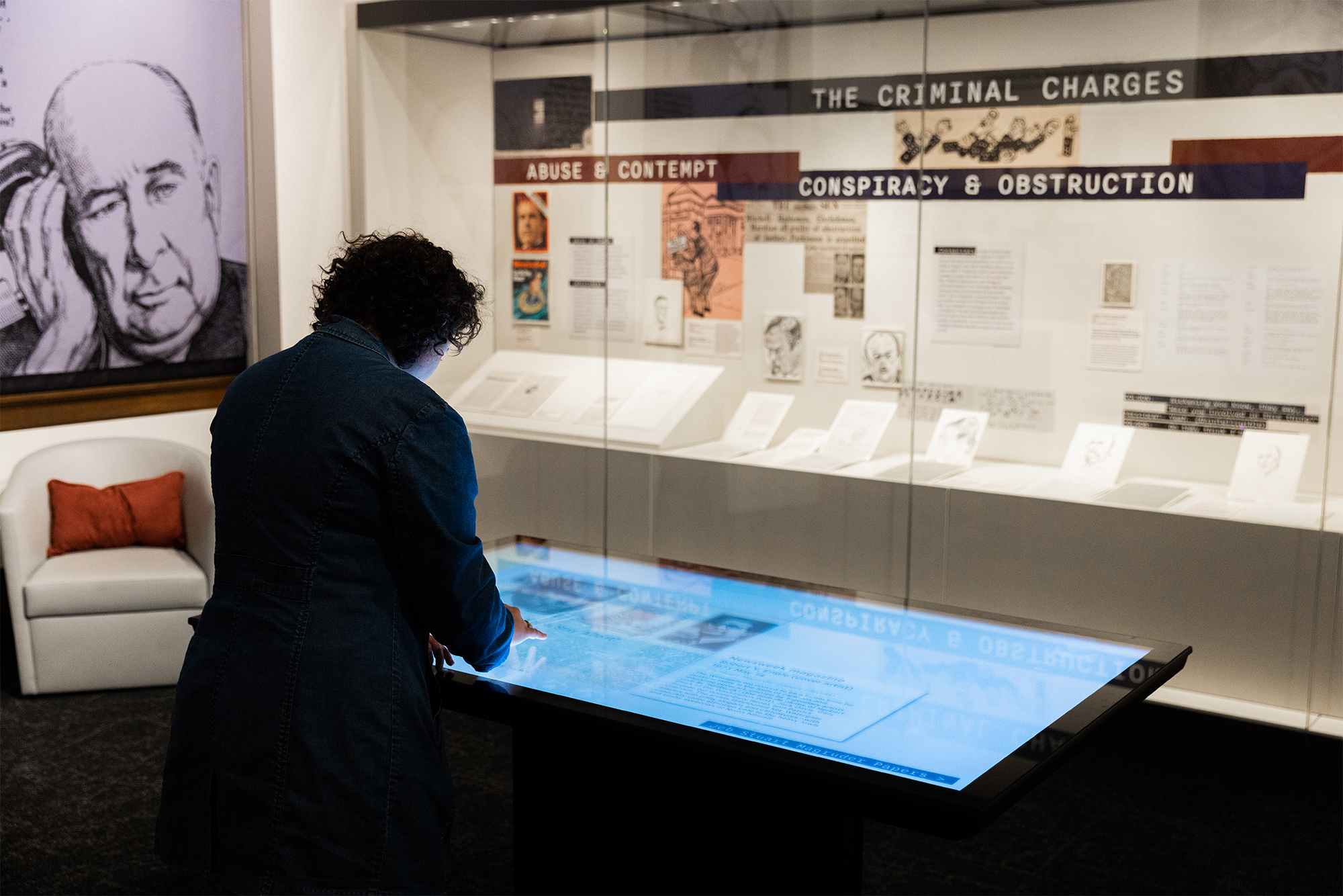 visitor with touch table, un-presidented exhibition, February 2024