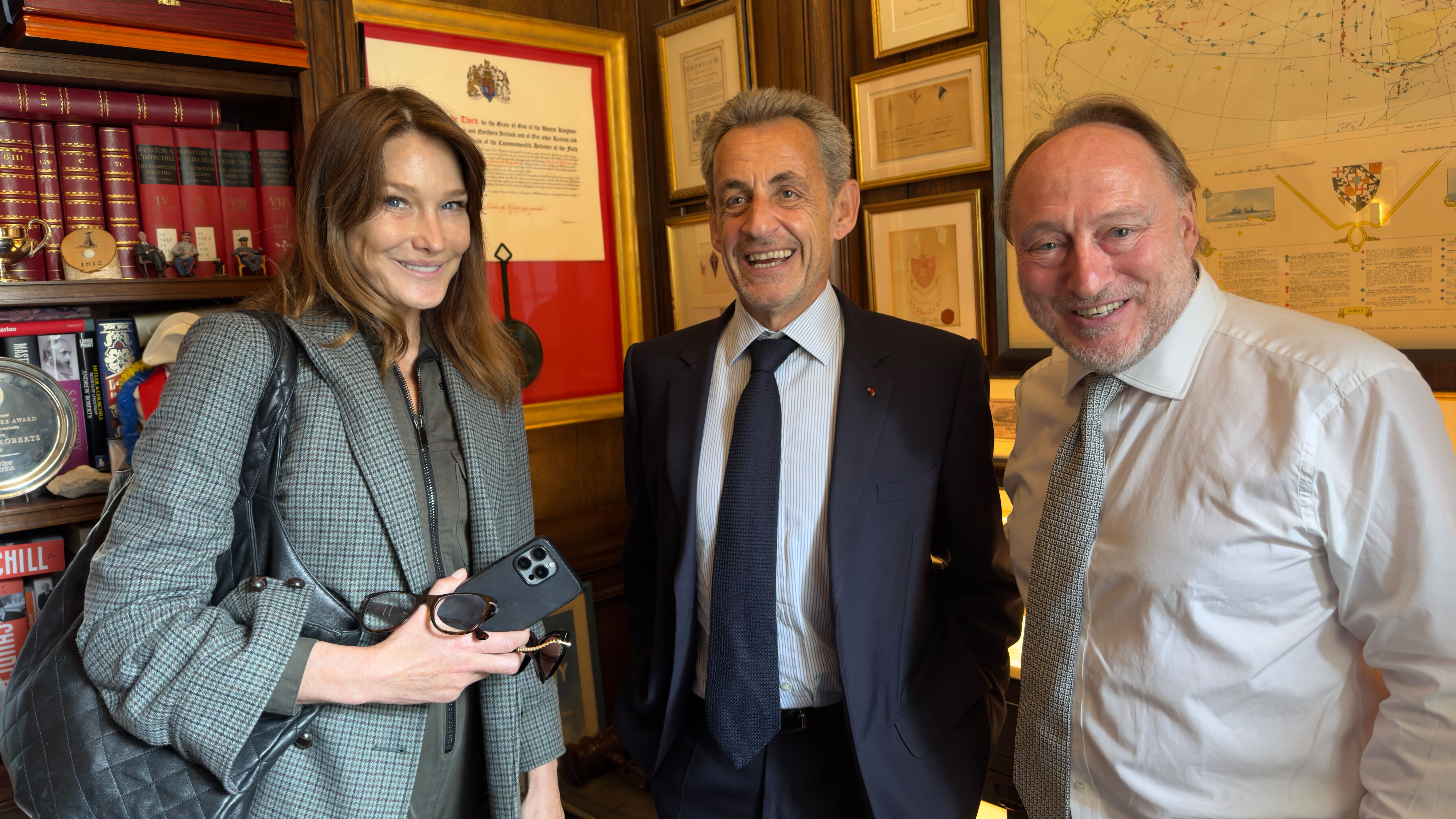 Carla Bruni, former French president Nicholas Sarkozy and Andrew Roberts are seen in London on June 4.