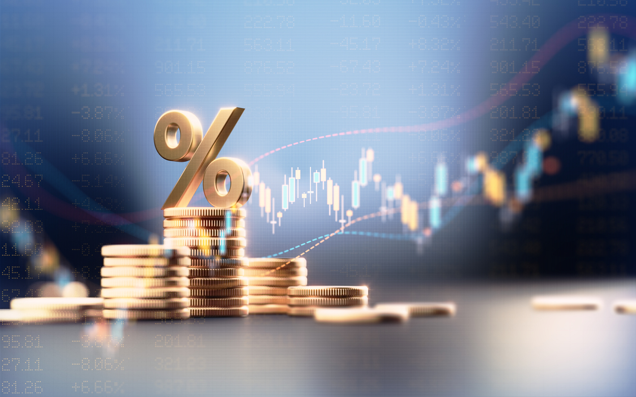 Percentage Sign On Top Of Coin Stacks Before Blue Financial Graph stock photo