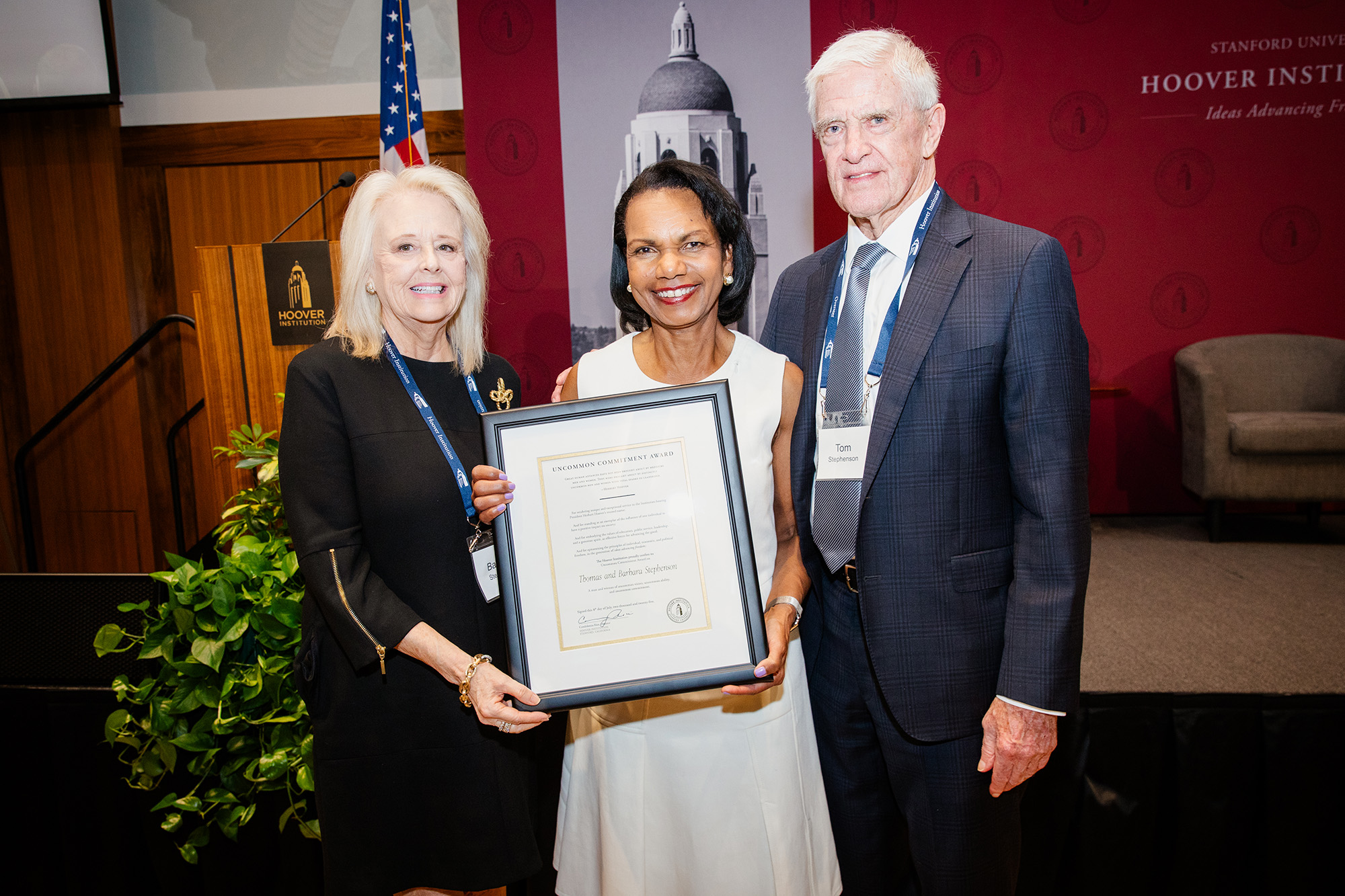 Hoover Institution Director Condoleezza Rice presents an Uncommon Commitment Award to Tom and Barbara Stephenson on July 8, 2025. (Patrick Beaudouin)
