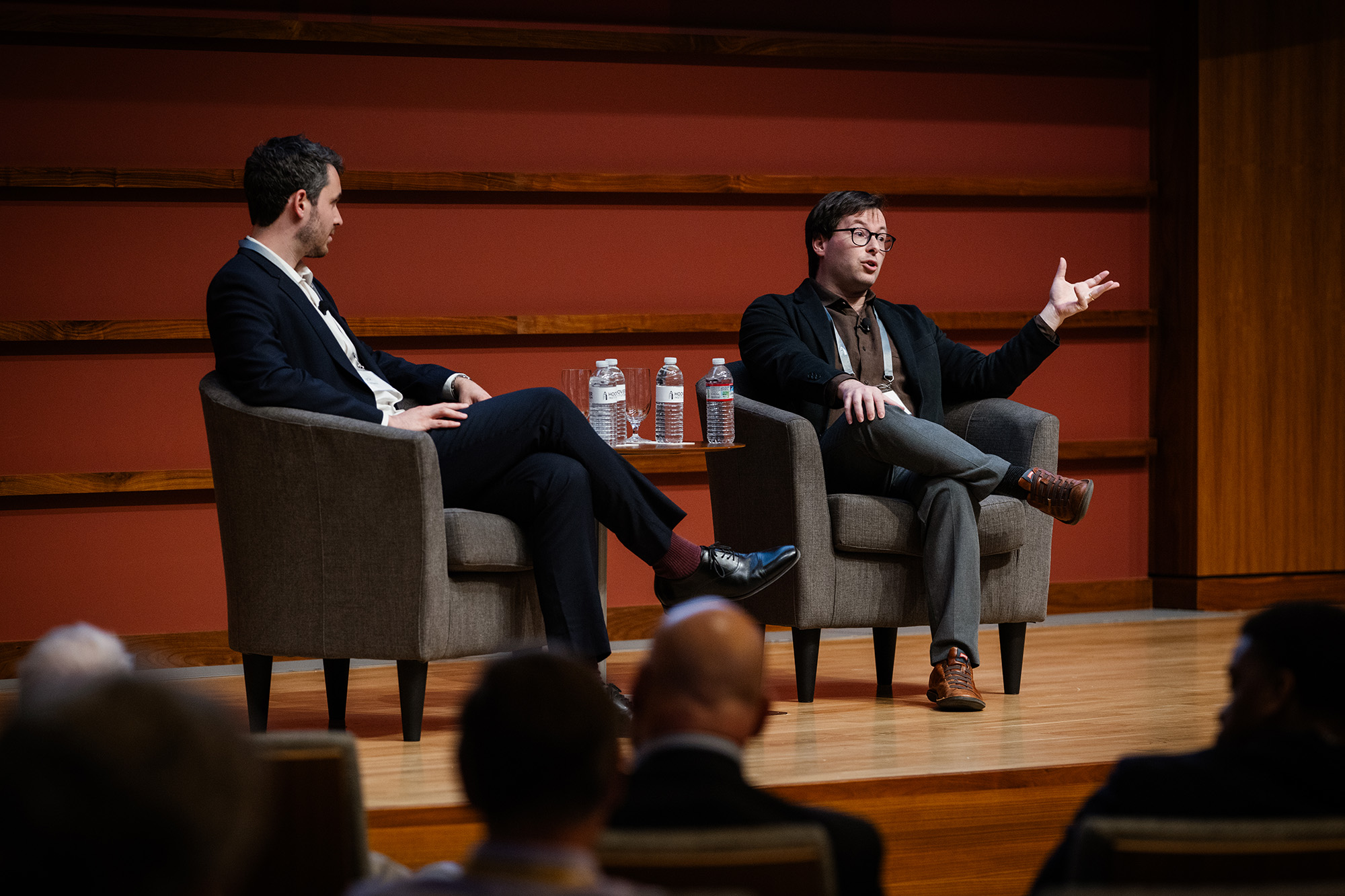 Hoover Fellow Matthew Lowenstein (right) speaks alongside Hoover Fellow Eyck Freymann in Hauck Auditorium on July 9, 2025. (Patrick Beaudouin)