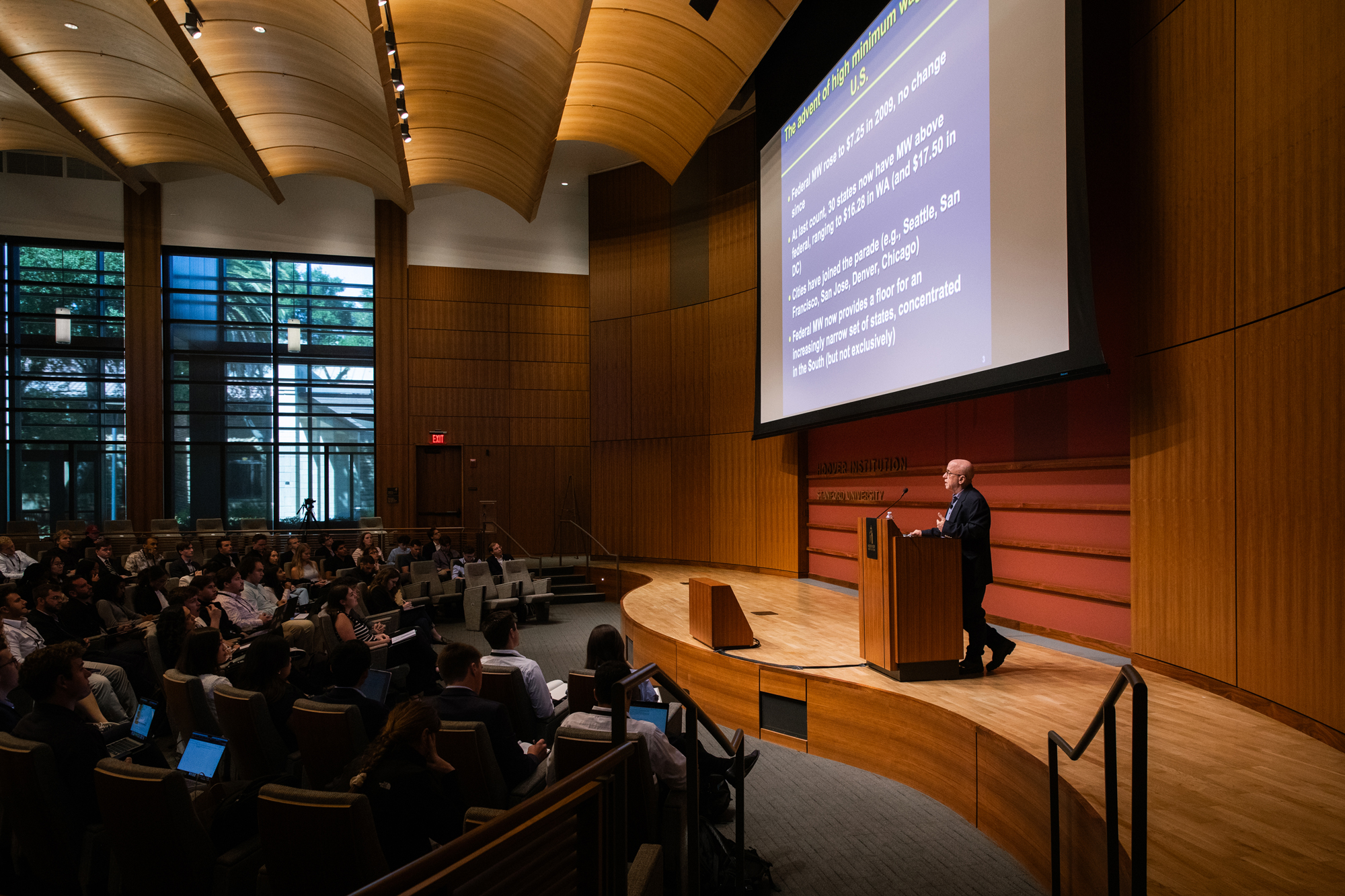 Visiting Fellow David Neumark speaks to HISPBC attendees about the impact of minimum wage laws in Hauck Auditorium on August 12, 2025. (Patrick Beaudouin)