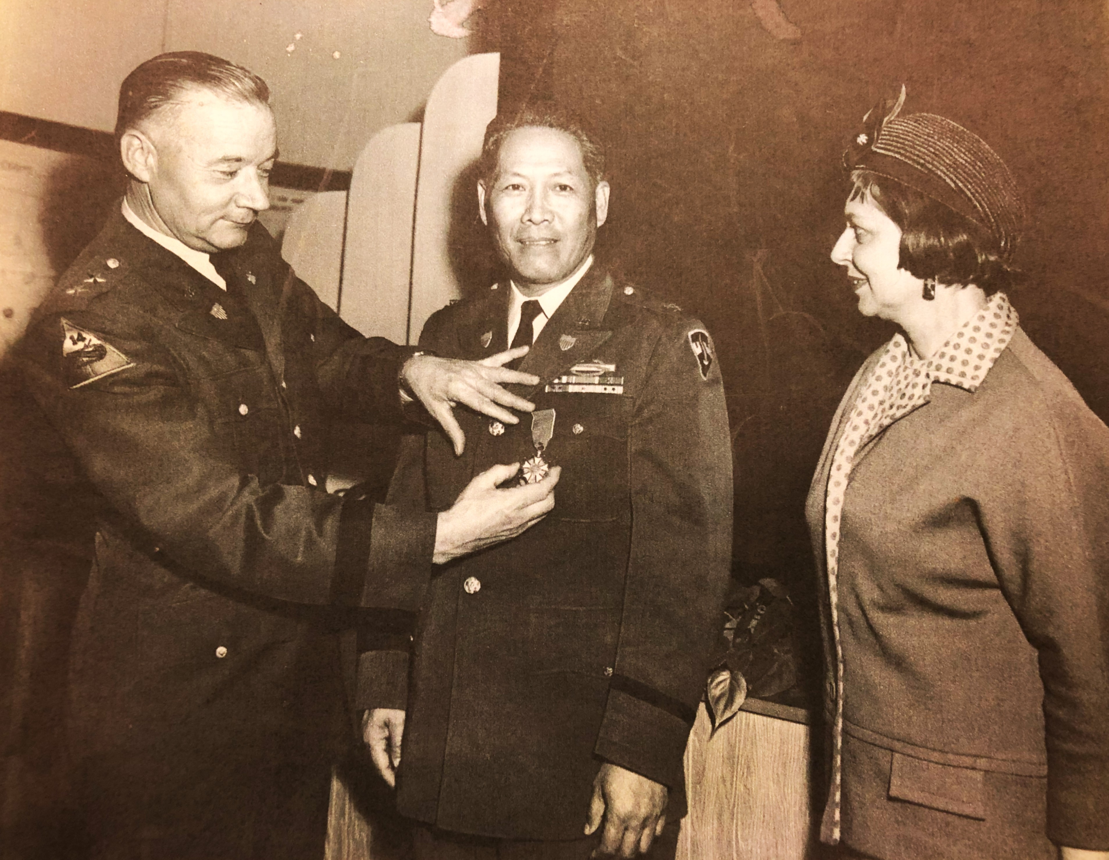 Young (middle) was awarded a medal for his brilliant performance during the Korean War.
