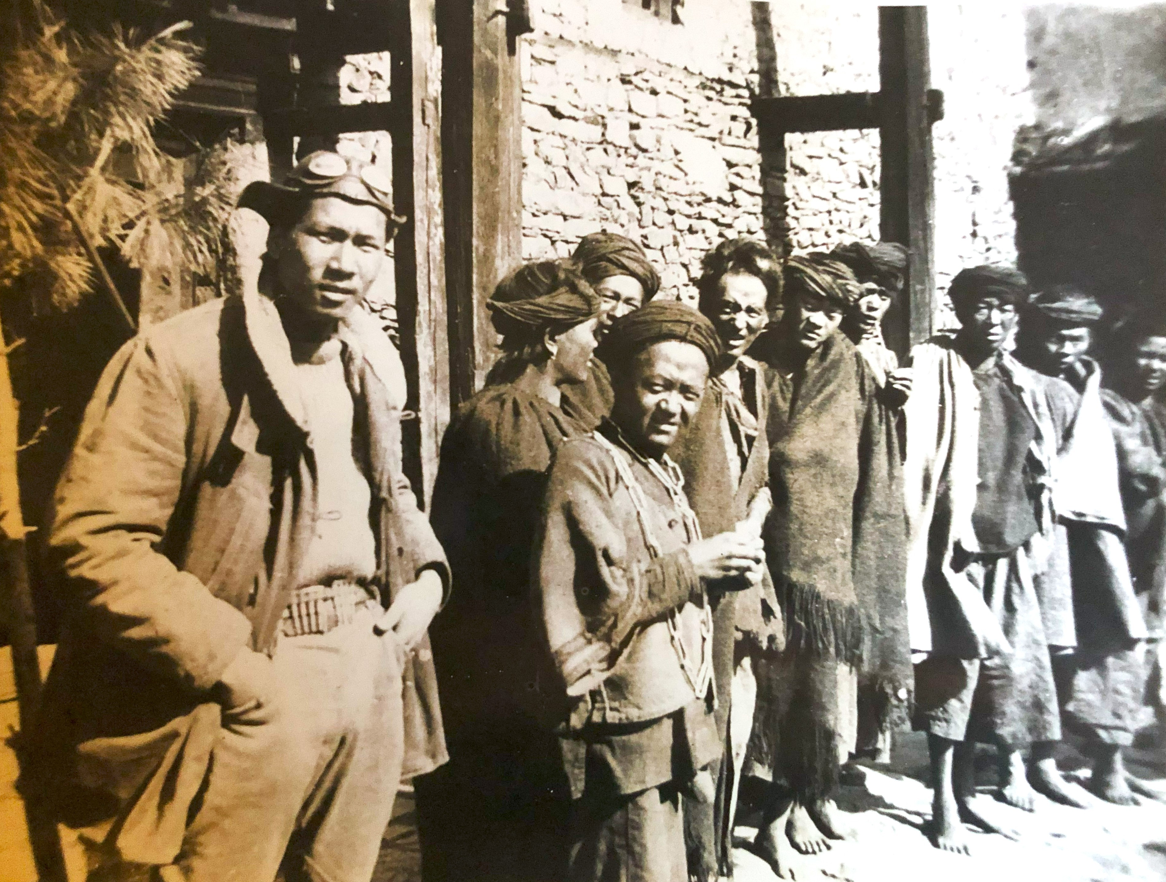 Young (left) with a group of Tibetans during his expedition on the Sino-Tibetan border.
