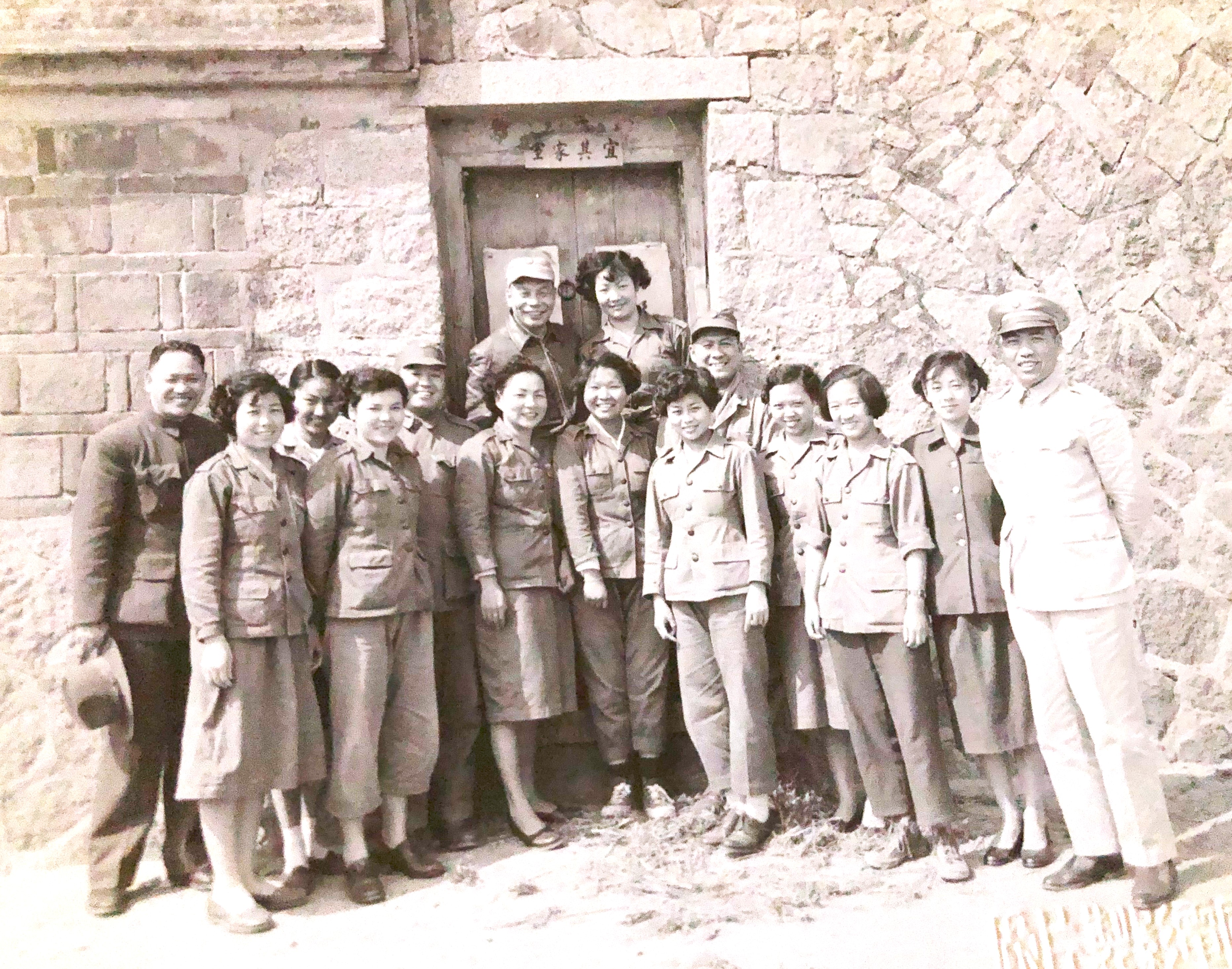 Young (back row, right), Chiang Ching-kuo (back row, left), and members of the Young Female Working Team in Taiwan in the early 1950s.