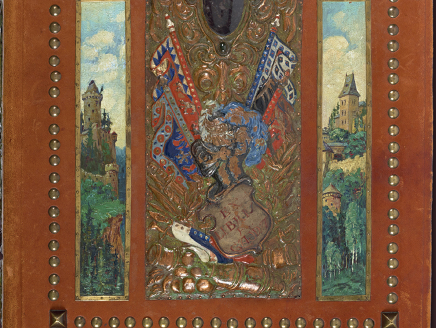 Detail of a leather bound photograph album with painting and metalwork