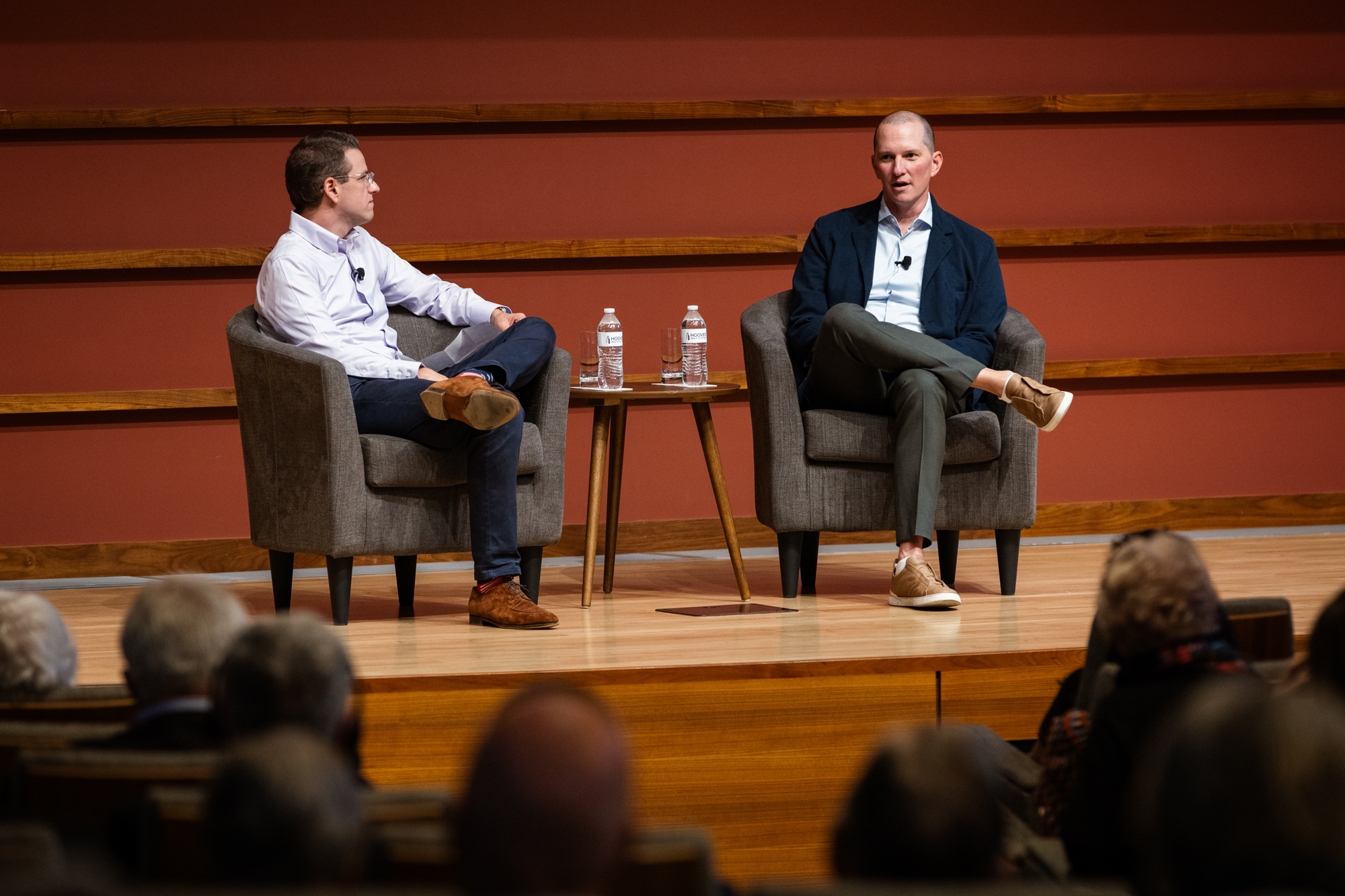 Senior Fellow Andrew B. Hall (left) and Brent Harris of Meta are seen in Hauck Auditorium on October 10, 2025. (Patrick Beaudouin)