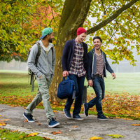 University students walking on footpath stock photo