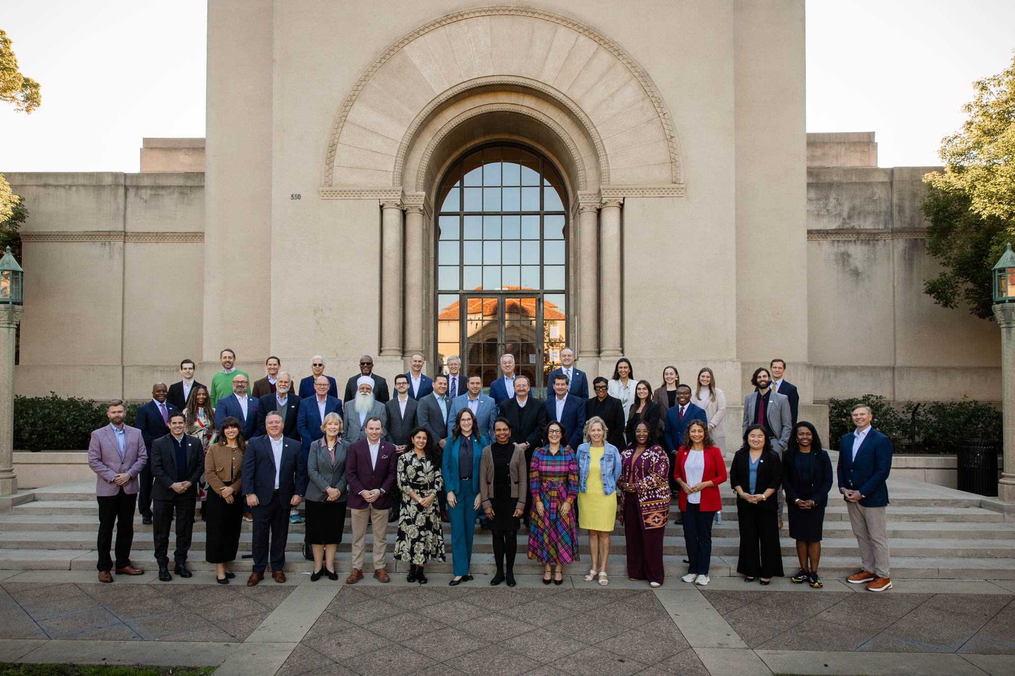 Participants in a joint Hoover–National Association of Counties gathering stand in front of Hoover Tower on December 8, 2025. (Patrick Beaudouin)