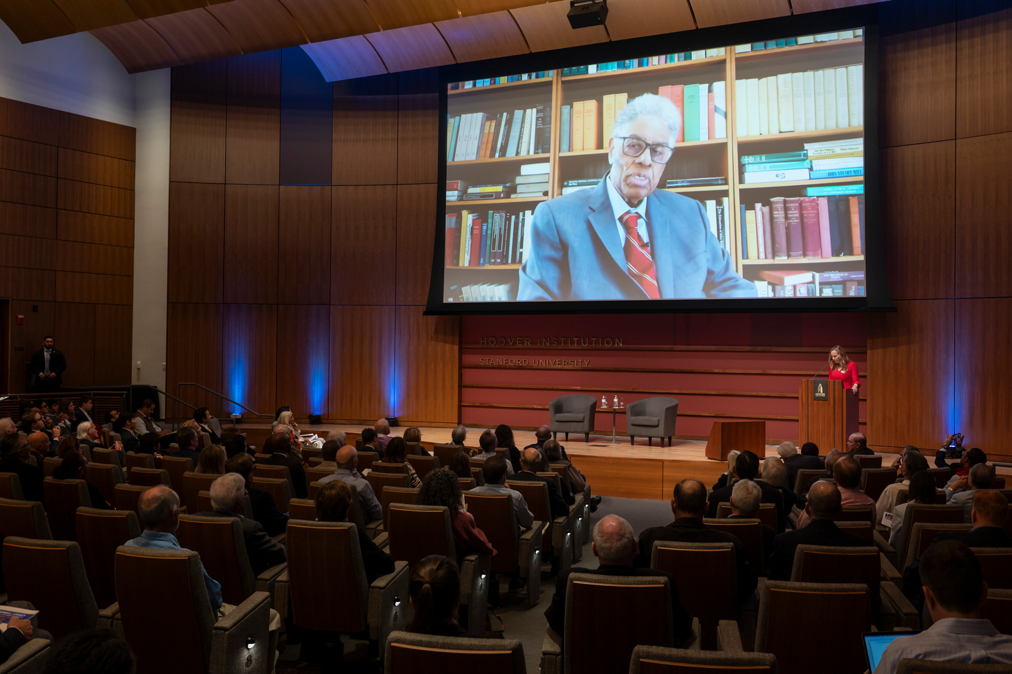 Thomas Sowell speaks on screen inside Hauck Auditorium at a celebration of his career on October 20, 2025. (Patrick Beaudouin)