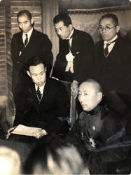 Prince Demchugdongrub (right, seated) meets with a group of local Japanese reporters in Tokyo, February 1941