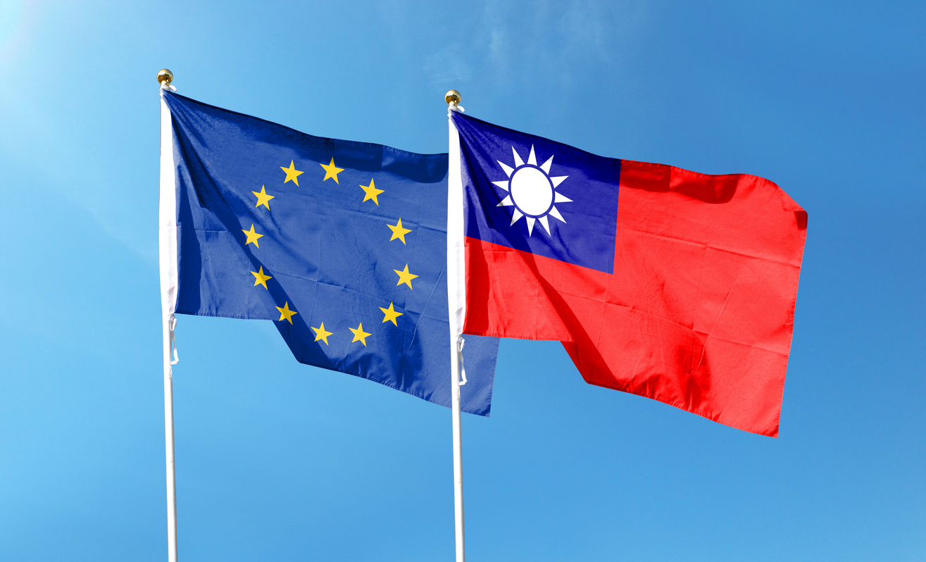 European Union flag and Taiwan flag on cloudy sky. waving in the sky stock photo