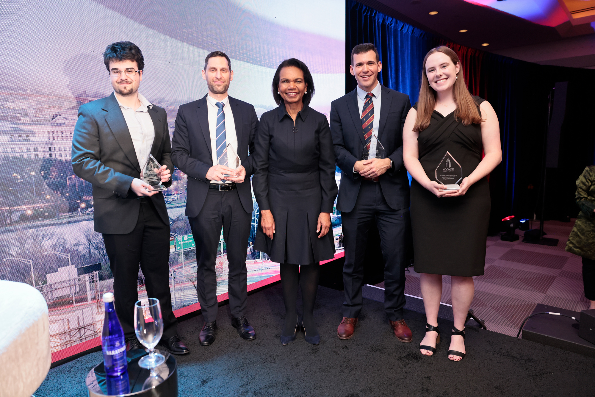 Winners of the 2025 HISPBC Student Essay Competition pose with Hoover Institution Director Condoleezza Rice on February 22, 2026. (Eric Draper)