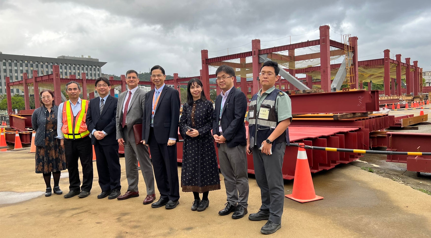 Group of people standing by the National Military Museum construction site in Taipei