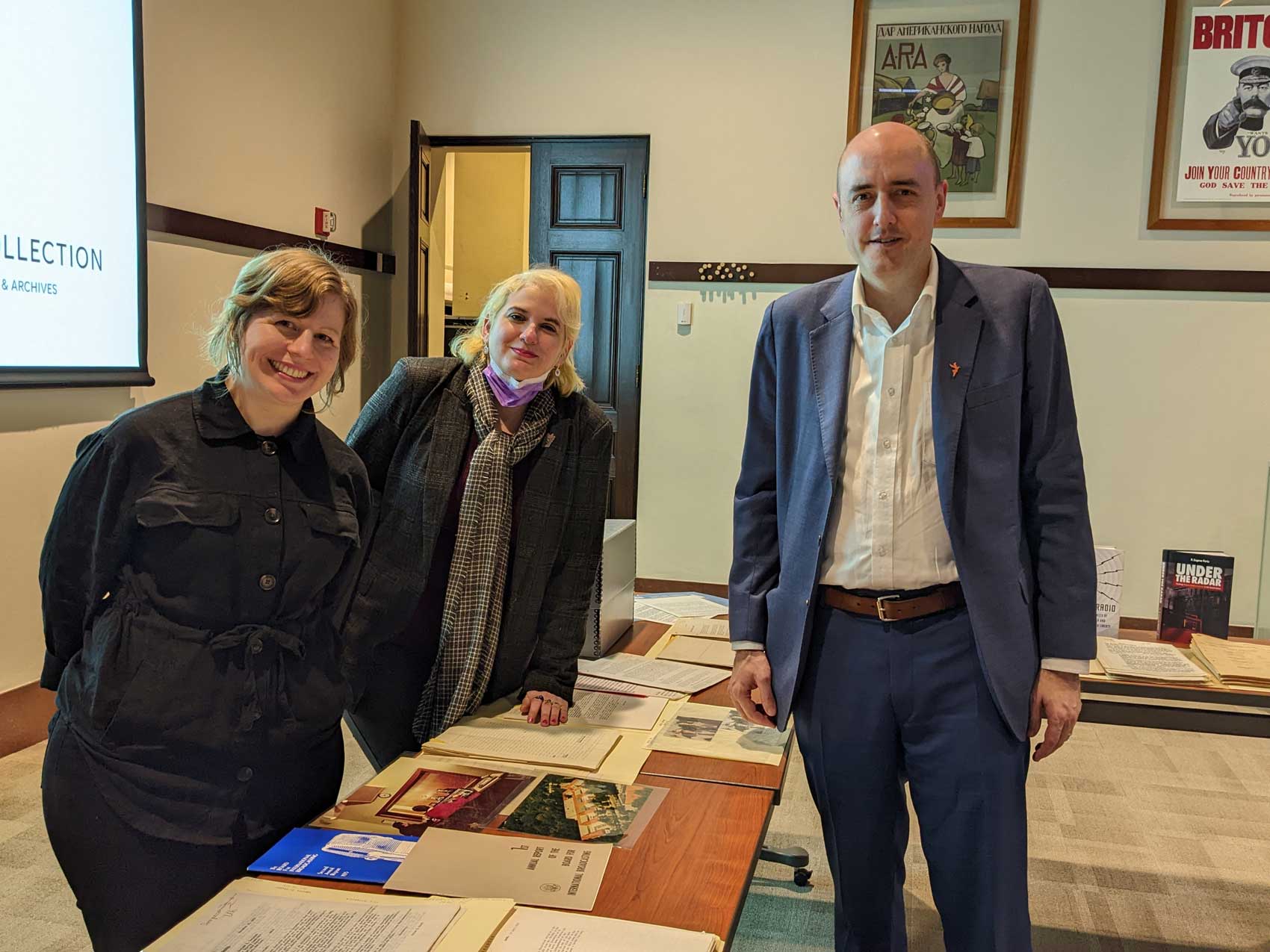 Left to righ - Tanya Yule, Sarah Cassone standing next to Jamie Fly, president of RFE/RL