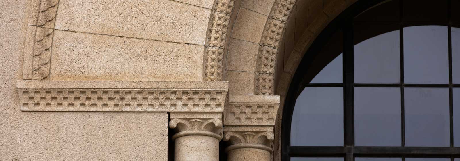 Arch, column, and window of entrance to Hoover Tower