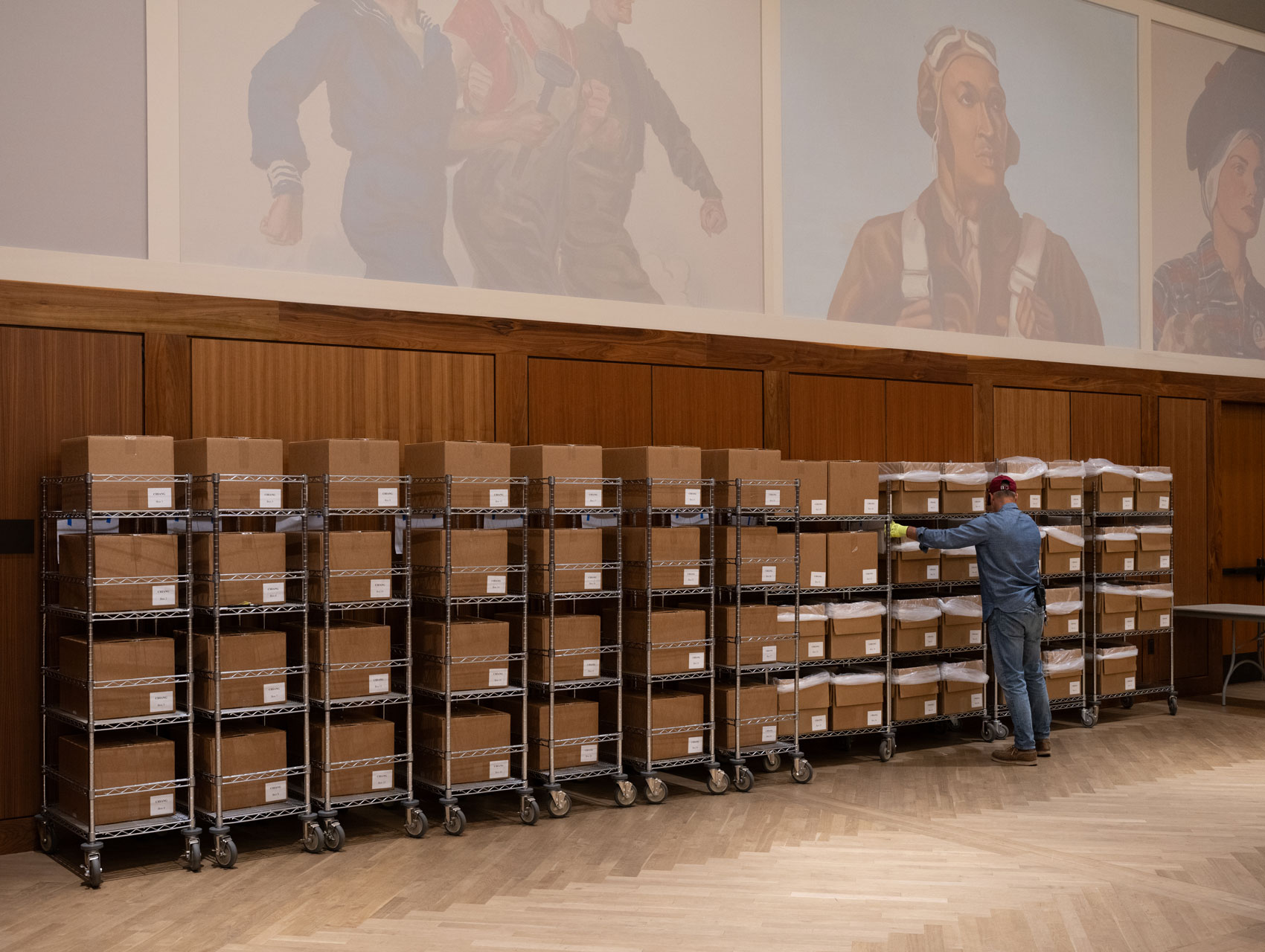 boxes on metal shelves along a wall