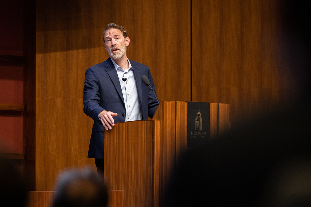 Markets vs. Mandates cohost and Hoover senior fellow Dominic Parker speaks in Hauck Auditorium on April 8, 2024. (Patrick Beaudouin)