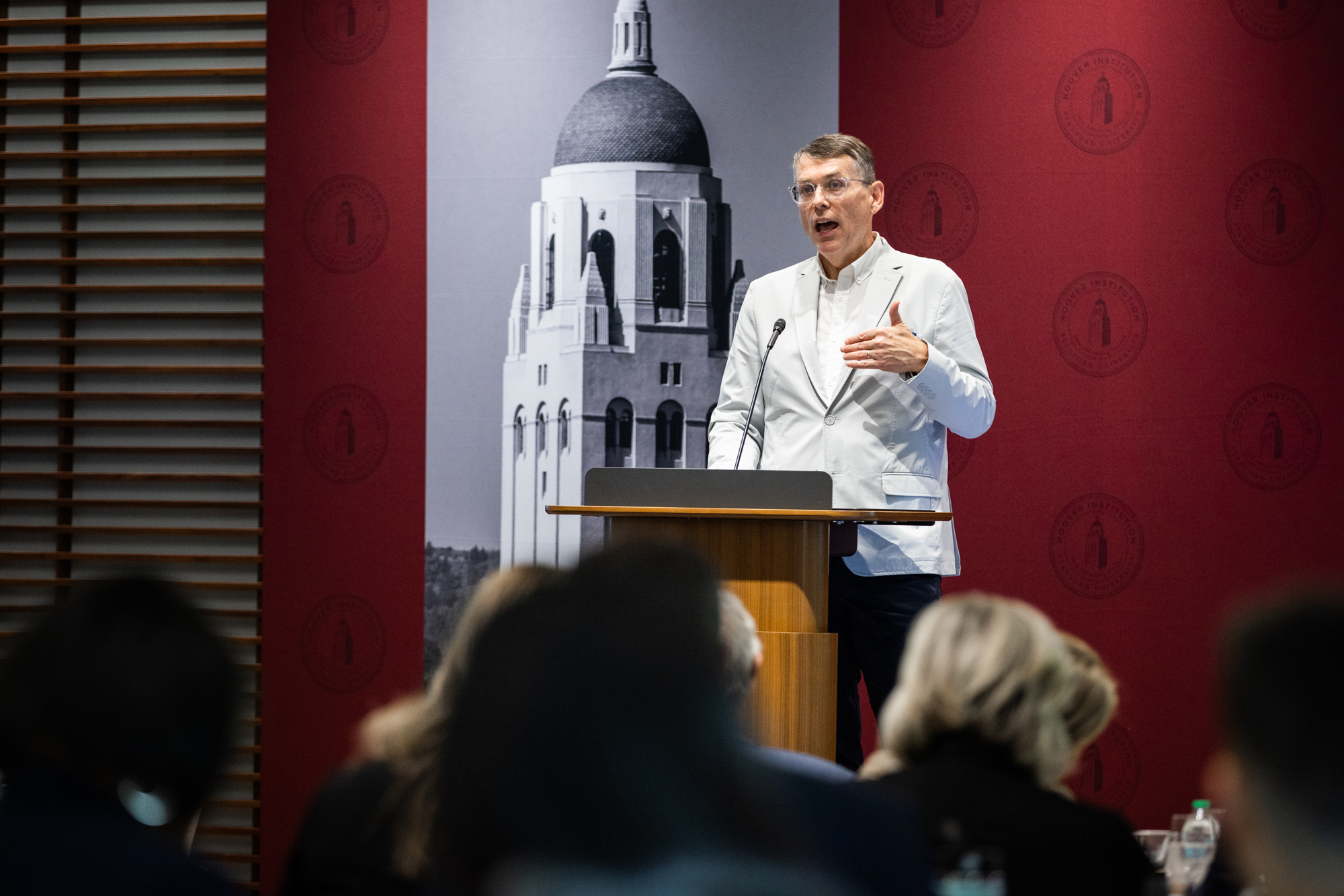 Hoover Fellow Thomas Dee speaks about the impact of mental health crisis first responders at the Conference on Collaborative State and Local Policy Research in Shultz Auditorium on January 27, 2025. (Patrick Beaudouin)