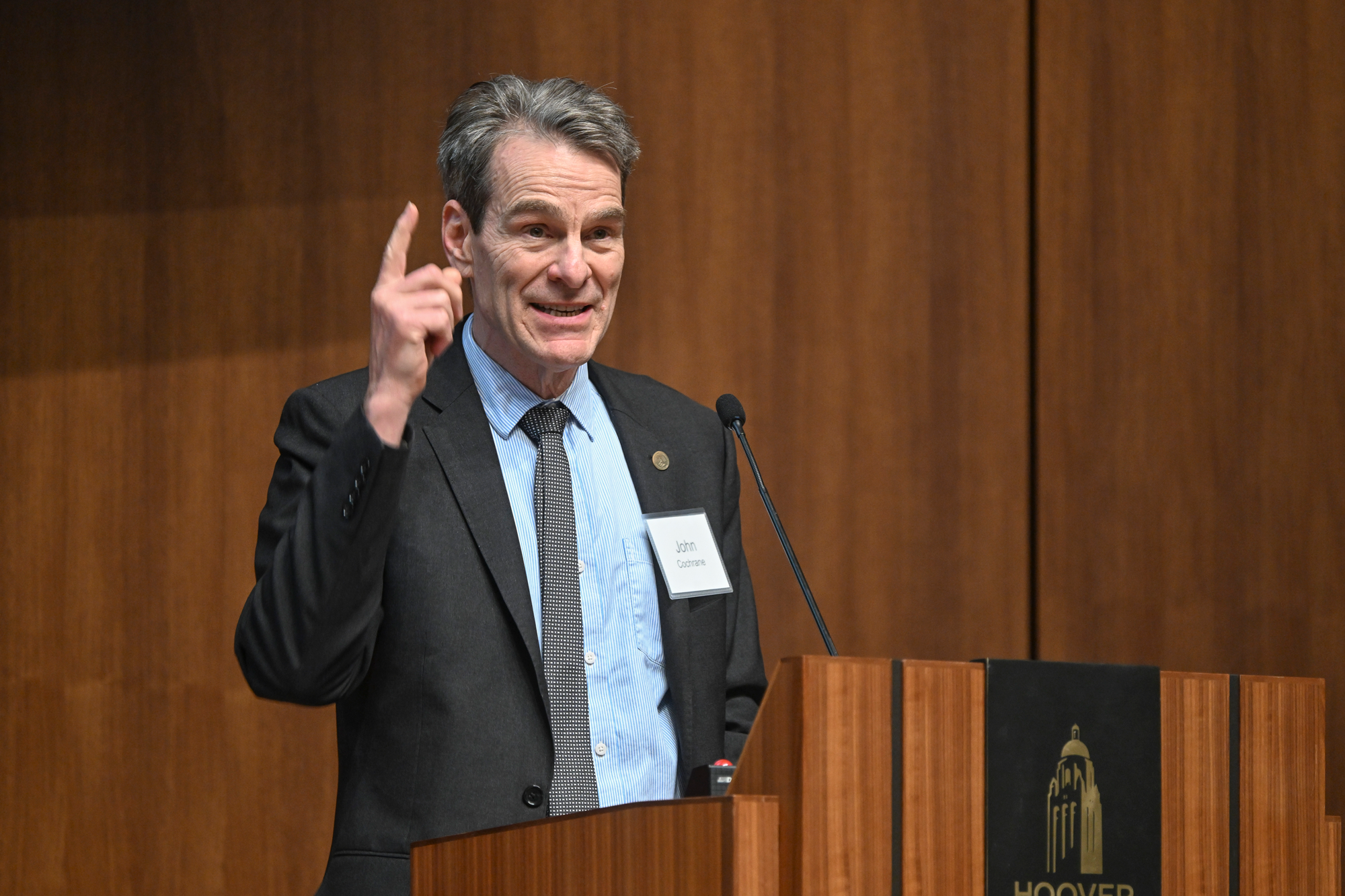 Senior Fellow John H. Cochrane speaks about the intersection between fighting inflation and fiscal policy in Hauck Auditorium on May 9, 2025. (Patrick Beaudouin)