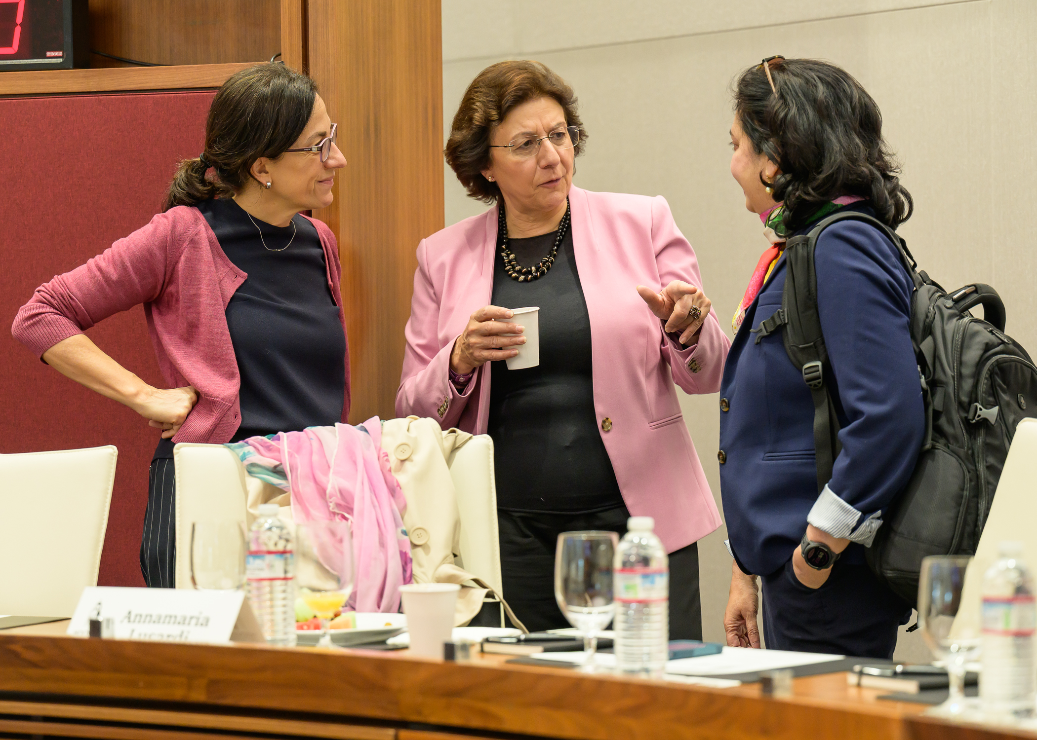Scholars (from left to right) Elena Carletti (Bocconi University), Annamaria Lusardi (Stanford University), and Anusha Chari (Hoover Institution) converse in between sessions.
