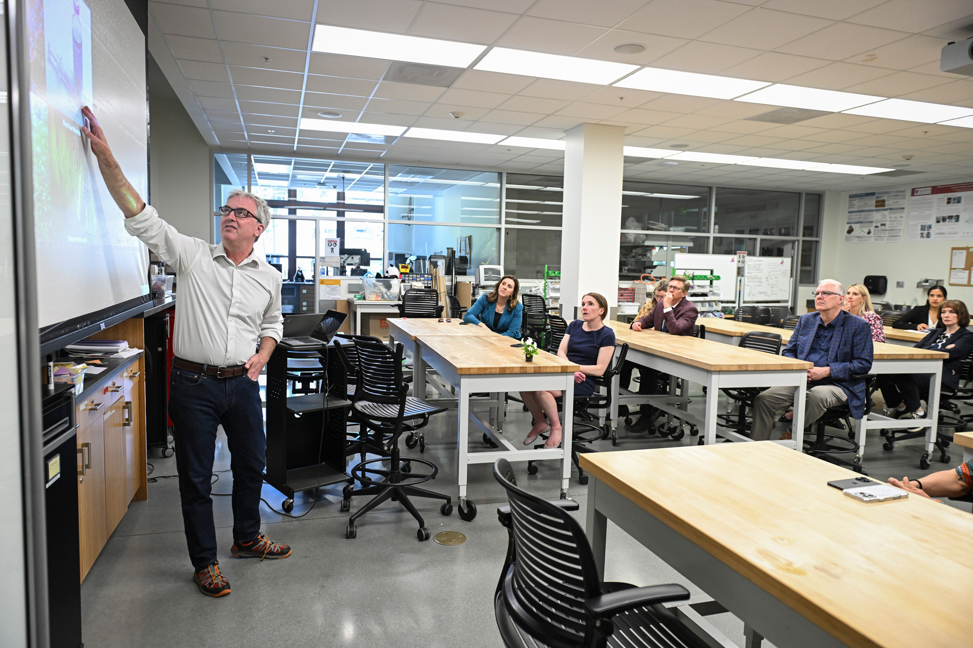 State education system leaders hear from Senior Fellow Drew Endy in his lab on May 16, 2025. (Rod Searcey)
