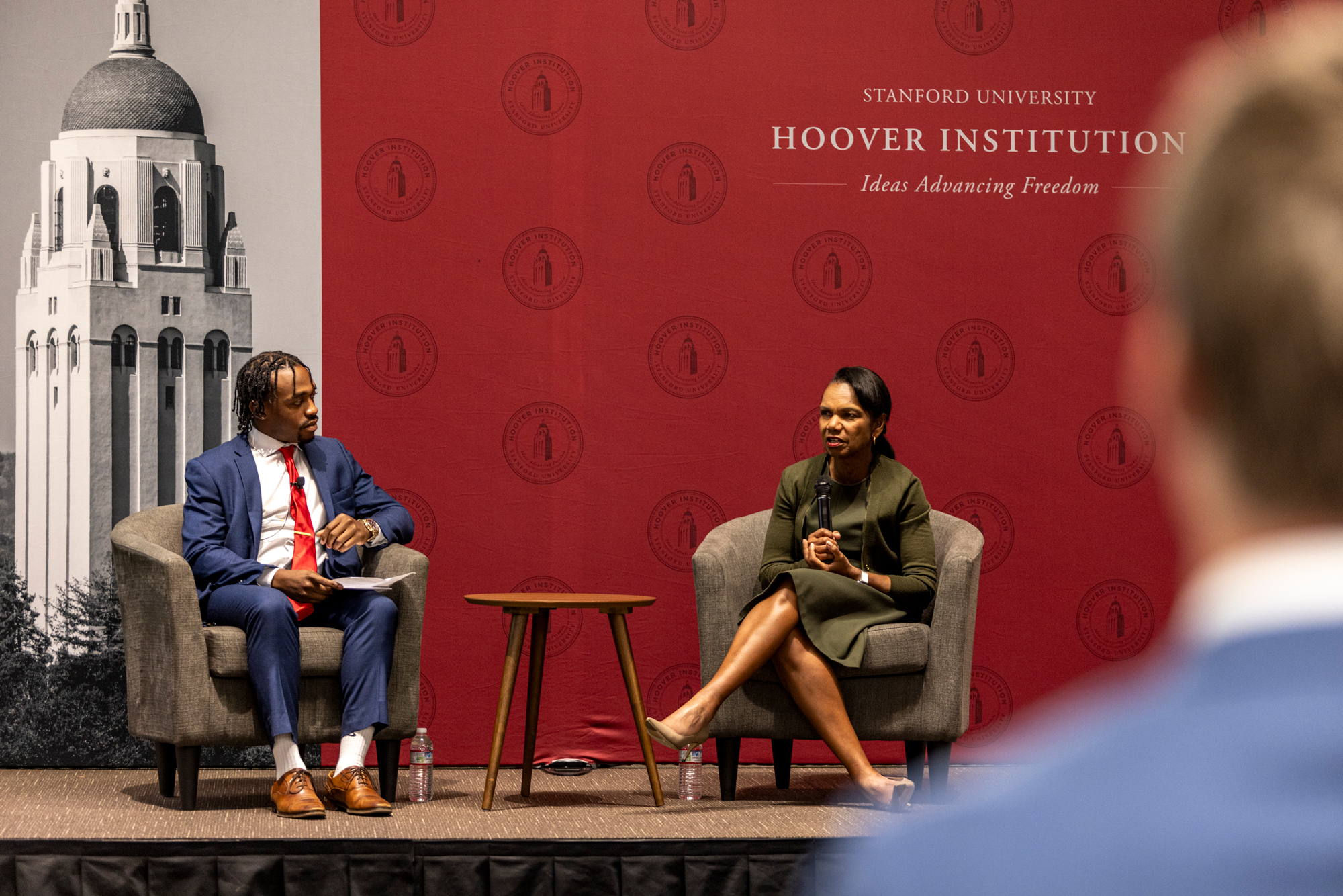 Hoover Institution Director Condoleezza Rice and AFC Fellow Tyreke Farquharson speak in Stauffer Auditorium on October 1, 2025. (Daniel Beck)
