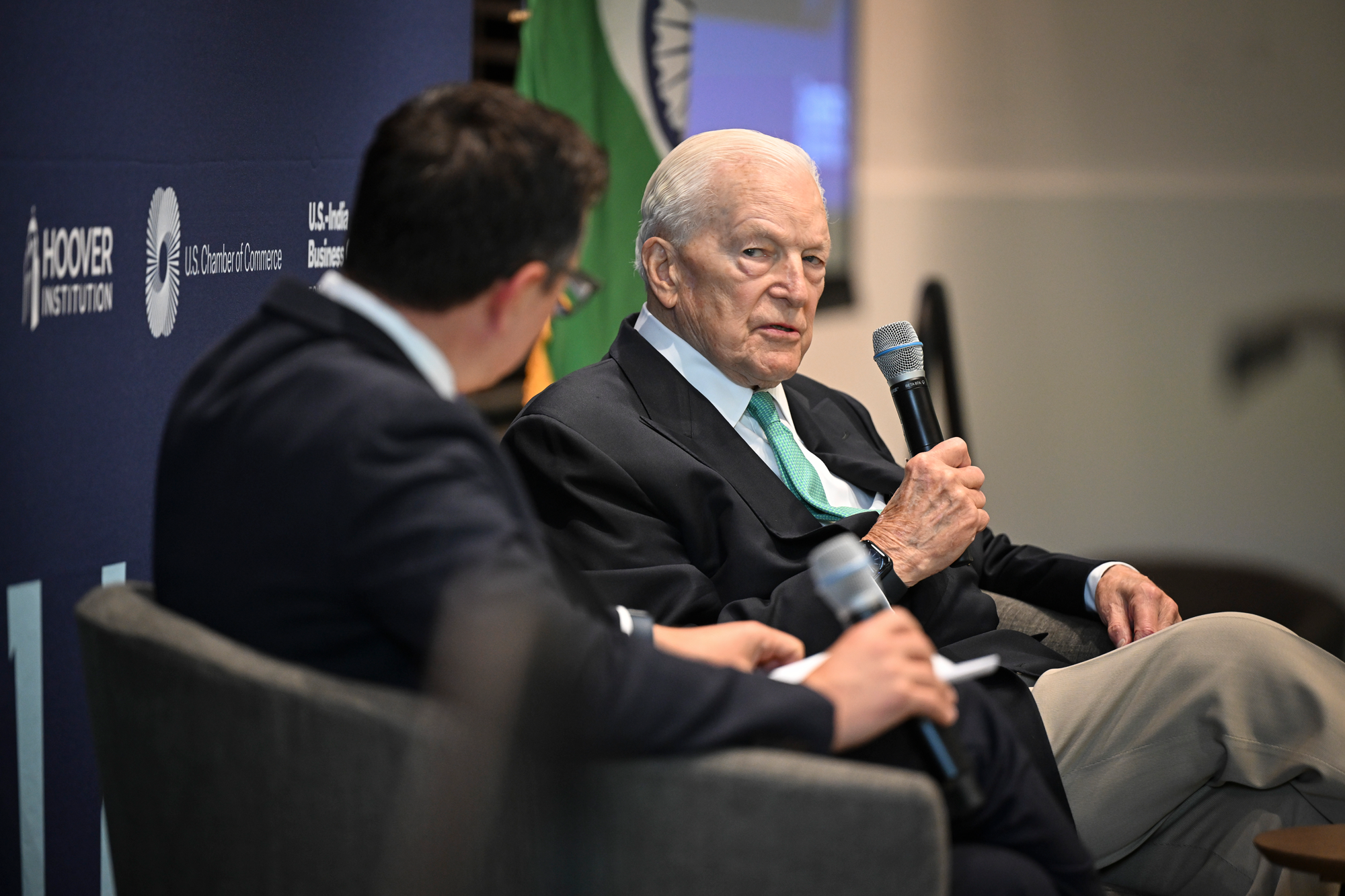 Distinguished Visiting Fellow David C. Mulford speaks about his experience as America’s ambassador to India with Research Fellow John Rivera-Dirks, who served alongside him during that time. (Rod Searcey)