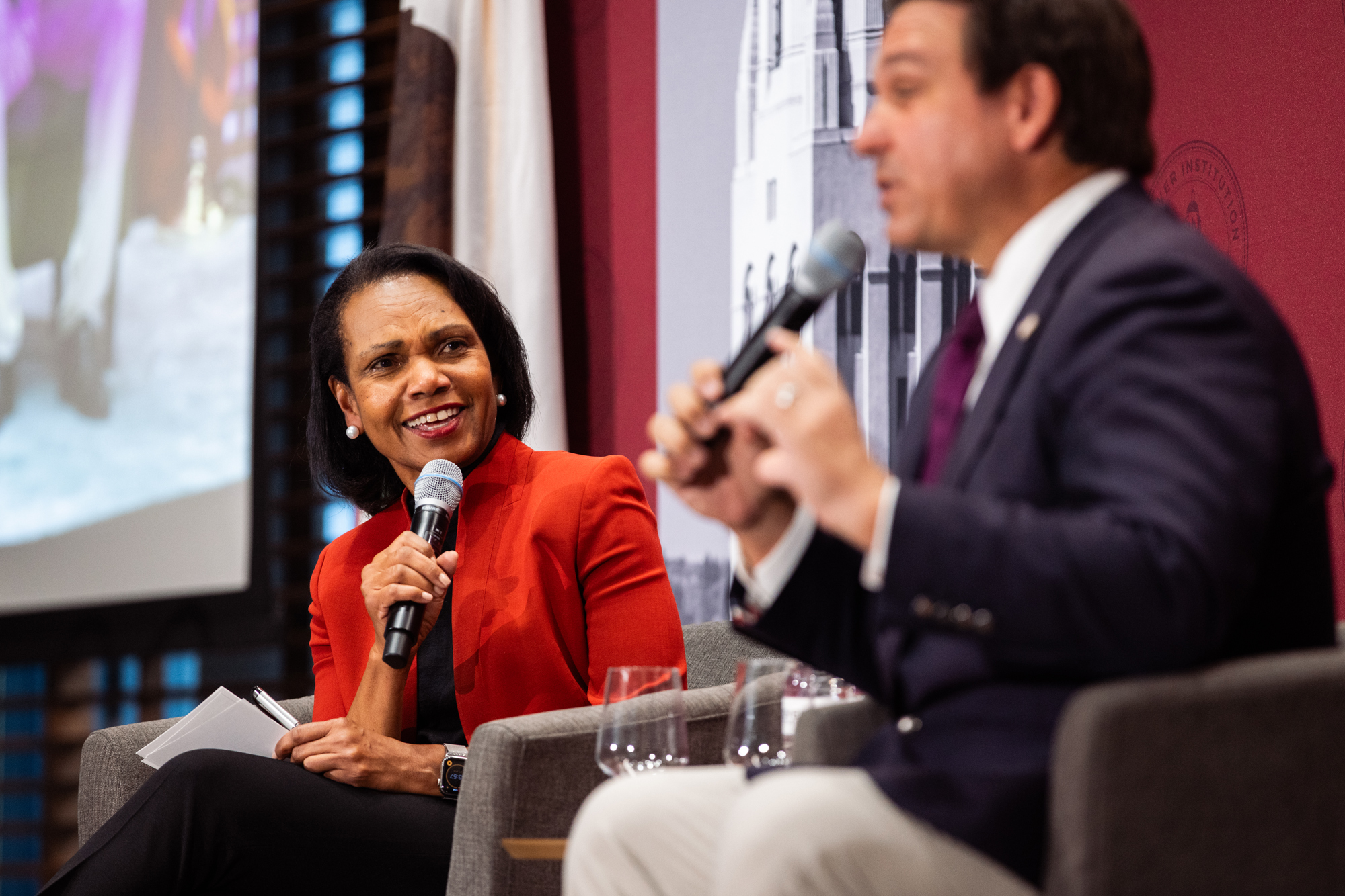 Hoover Institution Director Condoleezza Rice is seen speaking with Florida Governor Ron DeSantis in Shultz Auditorium on October 17, 2025. (Patrick Beaudouin)