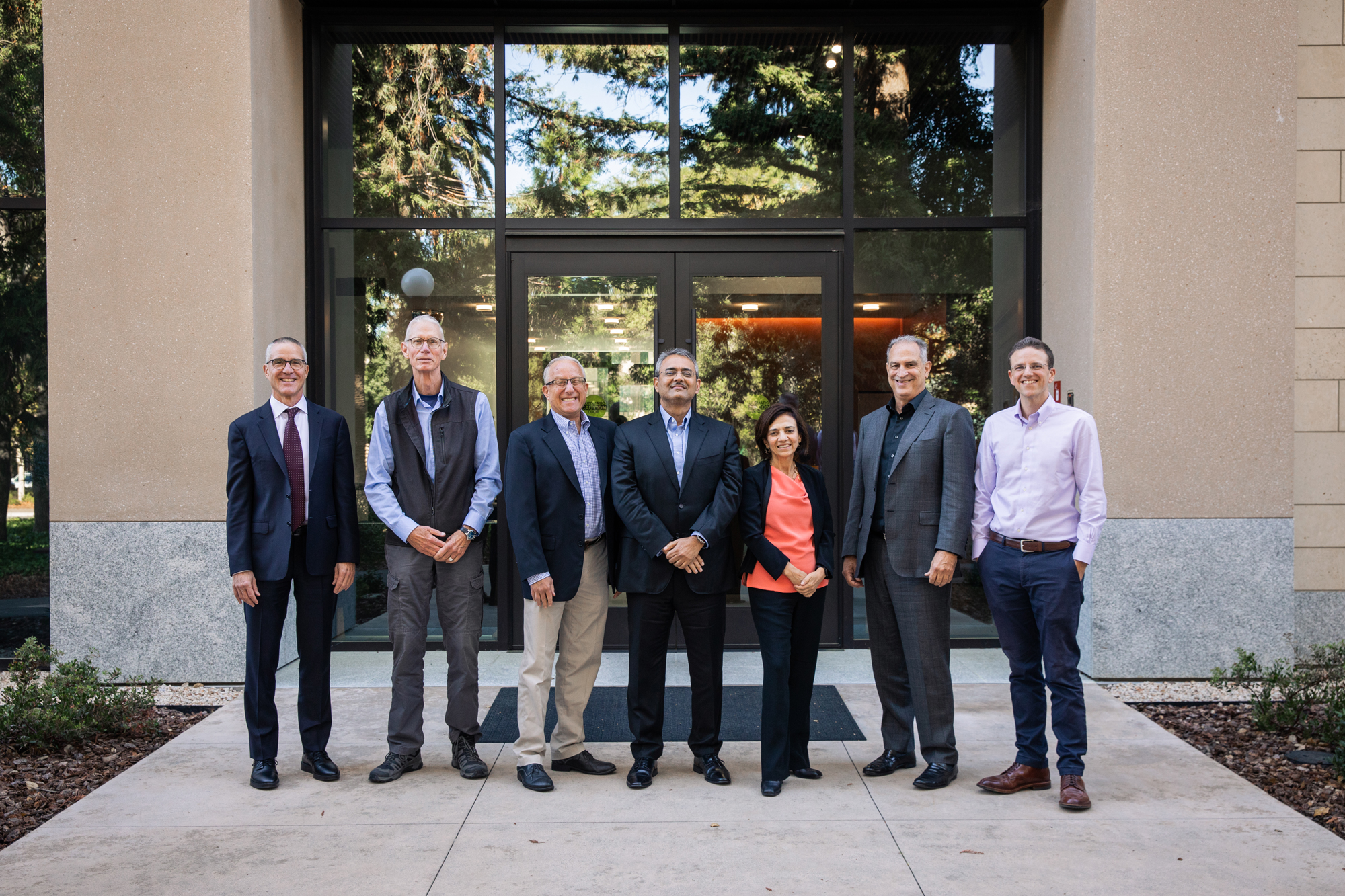 (From left to right) Hoover senior fellow participants in the Hoover Program on the Foundations of Economic Prosperity Ross Levine, Josiah Ober, Dan Kessler, Amit Seru, Paola Sapienza, Stephen Haber, and Andrew B. Hall are seen outside the Shultz Building on November 6, 2025. (Patrick Beaudouin)