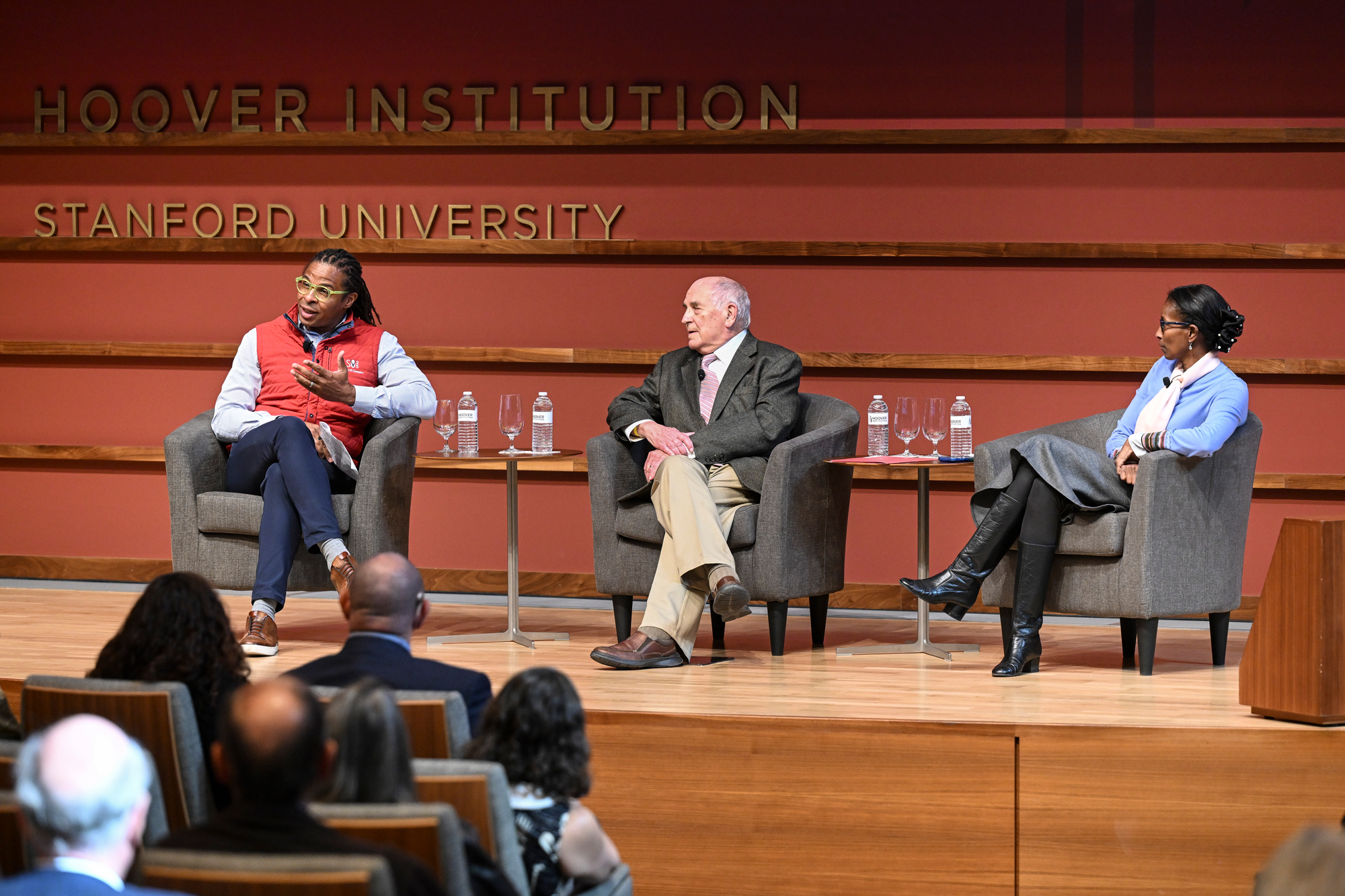 From left to right, Roland Fryer, Charles Murray and Hoover Research Fellow Ayaan Hirsi Ali are seen in Hauck Auditorium on October 20, 2025. (Patrick Beaudouin)