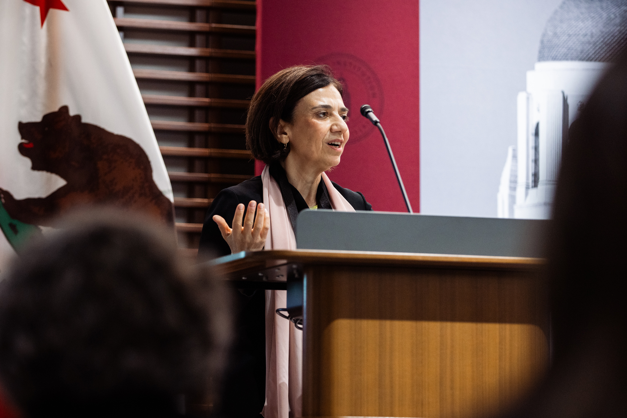 Paola Sapienza, Hoover senior fellow and codirector of the J-P Conte Initiative on Immigration, delivers opening remarks. (Patrick Beaudouin)